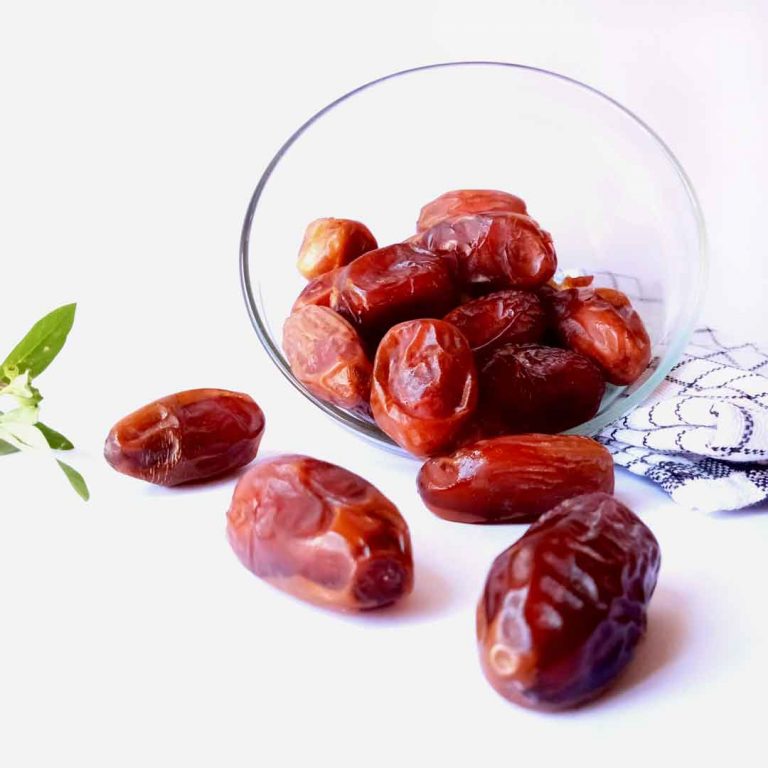 glass-bowl-dates-sits-white-qurma-cloth-with-green-leaf-it